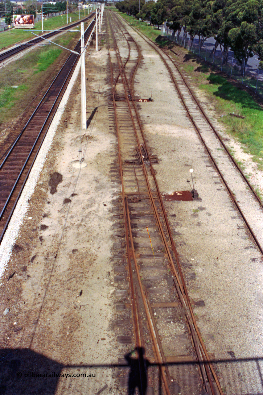 209-11
Ashfield, looking towards Perth from the station overbridge, the dual gauge tracks and yard running between the mainline and Railway Parade on the right. The standard gauge and narrow gauge points are easy to spot.
