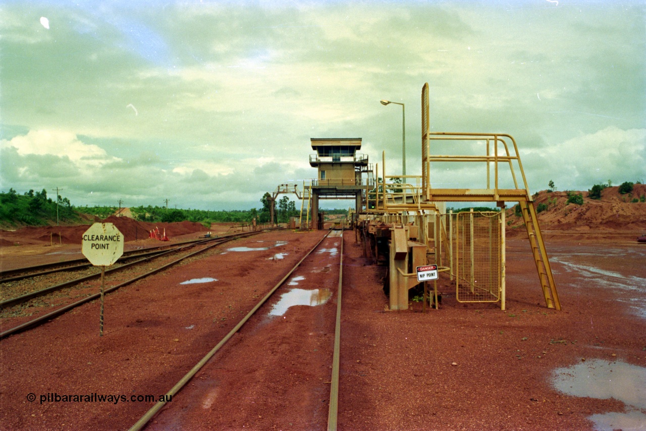 210-00
Weipa, Lorim Point, Comalco rail dump station for unloading the bauxite trains from Andoom mine looking towards Andoom from the workshops end.
