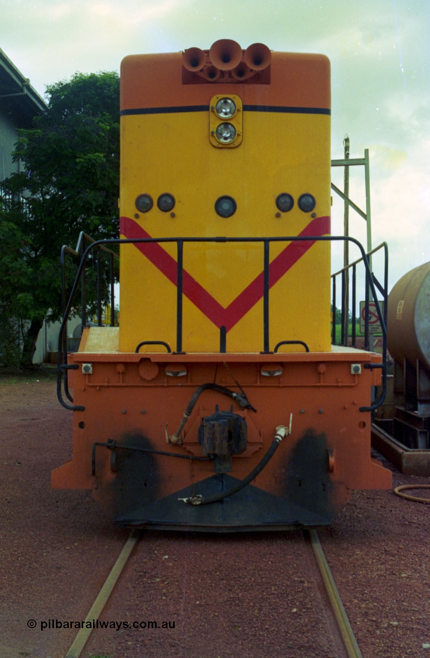 210-11
Weipa, Lorim Point railway workshops, back view of Comalco R 1001 loco Clyde Engineering EMD model GT26C serial 72-752 while is sits at the fuel point, items of note are the five chime horn cut into the hood and as the Weipa locomotives don't work in MU there is only the train brake hose and the main res hose for charging the belly dump discharge doors.
Keywords: R1001;Clyde-Engineering;EMD;GT26C;72-752;1.001;Comalco;