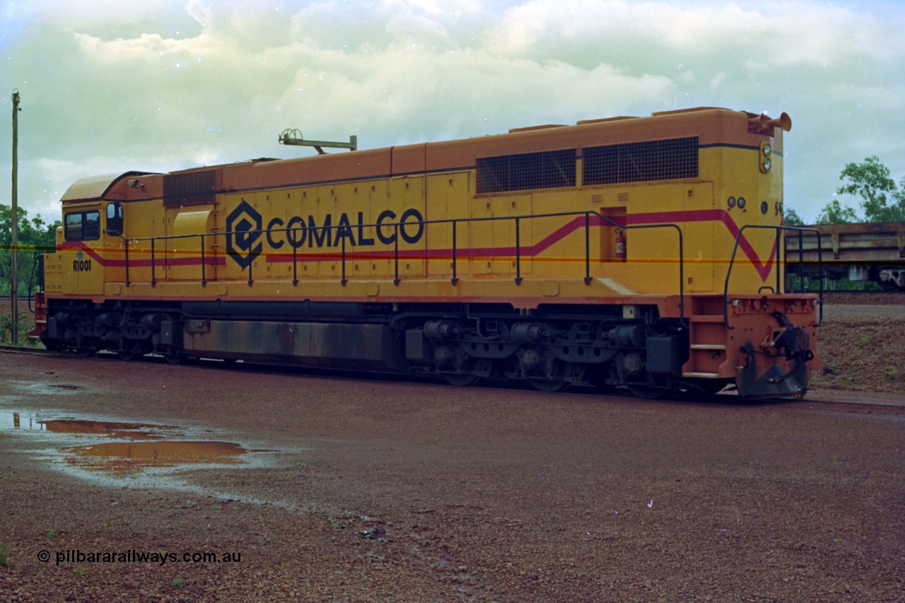 210-18
Weipa, Lorim Point railway workshops, observer's side of Comalco R 1001 loco Clyde Engineering EMD model GT26C serial 72-752 while is sits at the fuel point, items of note are the second 'tropical roof', CCTV looking down the driver's 'off side' and the five chime horn cut into the hood. Also noticeable, the units don't have dynamic brakes fitted so there is no brake 'blister' in the middle of the hood like the WAGR L or VR C classes which are also GT26C models and the fire extinguisher cut in below the radiator.
Keywords: R1001;Clyde-Engineering;EMD;GT26C;72-752;1.001;Comalco;