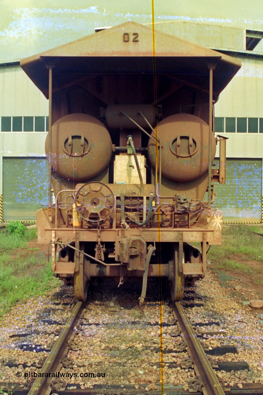 210-21
Weipa, Lorim Point railway workshops, rear view of Comalco ore waggon 3002, shows handbrake, triple valve and piping and air receivers, this is one of the compressor equipped waggons.
Keywords: HMAS-type;Comeng-Qld;Comalco;