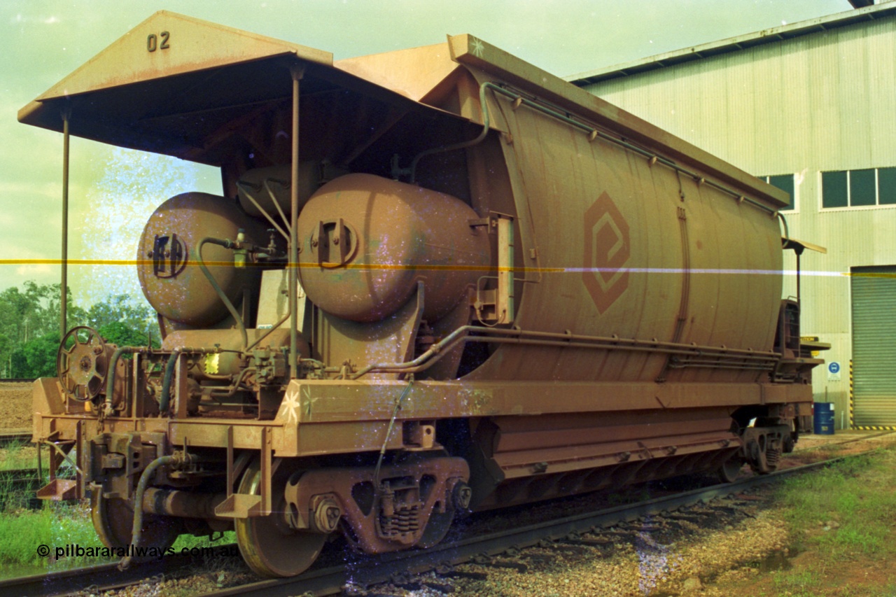 210-22
Weipa, Lorim Point railway workshops, side view of Comalco ore waggon 3002, shows handbrake, triple valve and piping, side piping and controls, bogies and discharge doors and air receivers, this is one of the compressor equipped waggons.
Keywords: HMAS-type;Comeng-Qld;Comalco;