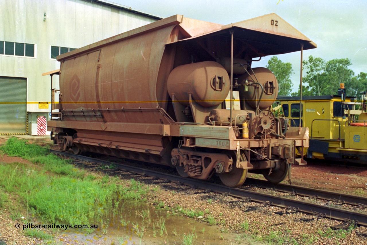 210-23
Weipa, Lorim Point railway workshops, side view of Comalco ore waggon 3002, shows handbrake, triple valve and piping, side piping and controls, bogies and discharge doors and air receivers, this is one of the compressor equipped waggons.
Keywords: HMAS-type;Comeng-Qld;Comalco;