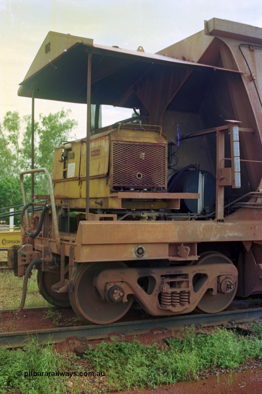 210-24
Weipa, Lorim Point railway workshops, view of compressor end of Comalco ore waggon 3002, shows compressor, fuel tank, controls and piping and bogie.
Keywords: HMAS-type;Comeng-Qld;Comalco;