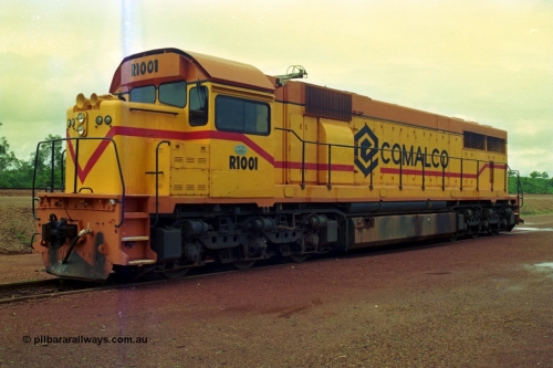 210-09
Weipa, Lorim Point railway workshops, observer side view of Comalco R 1001 loco Clyde Engineering EMD model GT26C serial 72-752 while is sits at the fuel point, items of note are these units were setup to have the long hood leading, the CCTV camera looking down the long hood, the second 'tropical roof' and the five chime horn cut into the nose. Also noticeable, the units don't have dynamic brakes fitted so there is no brake 'blister' in the middle of the hood like you see on the WAGR L or VR C classes which are also GT26C models.
Keywords: R1001;Clyde-Engineering;EMD;GT26C;72-752;1.001;Comalco;