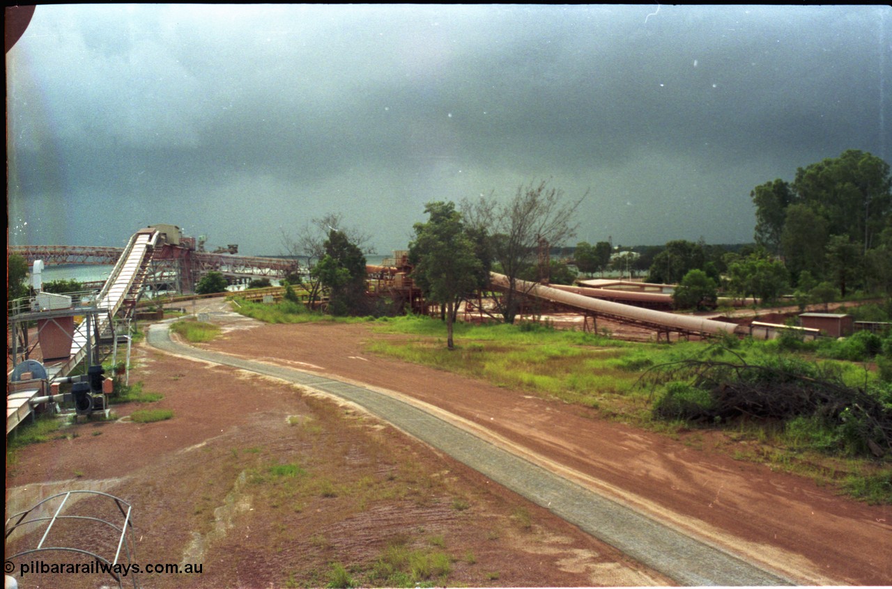 211-10
Weipa, view from bottom of the kaolin silos looking towards the mouth of the Embley River with the bauxite wharf and kaolin feed conveyor associated infrastructure.
