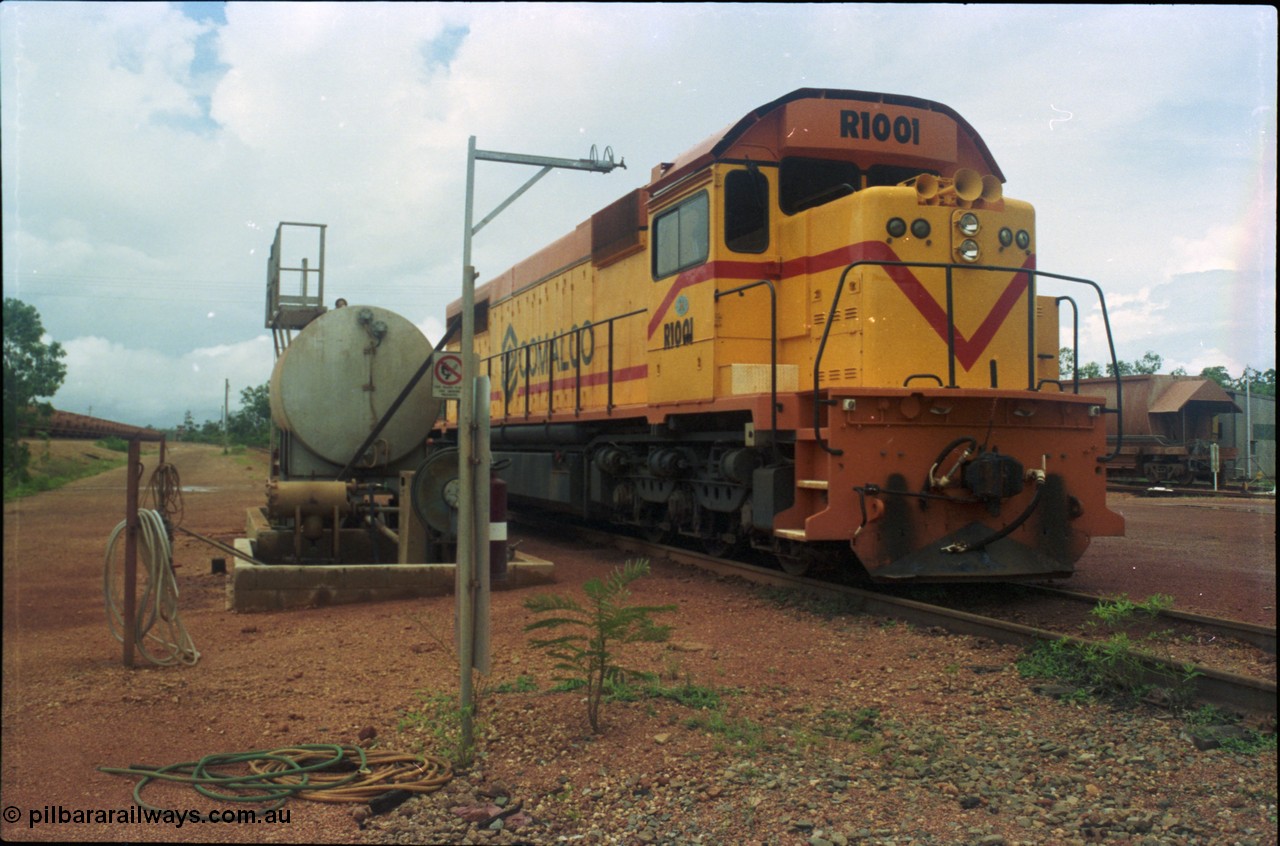 211-25
Weipa, Lorim Point railway workshops, 3/4 LHS or driver's side view of Comalco R 1001 loco Clyde Engineering EMD model GT26C serial 72-752 while is sits at the fuel point, items of note are the second 'tropical roof' and the five chime horn cut into the nose. Also noticeable, the units don't have dynamic brakes fitted so there is no brake 'blister' in the middle of the hood like the WAGR L or VR C classes which are also GT26C models.
Keywords: R1001;Clyde-Engineering;EMD;GT26C;72-752;1.001;Comalco;