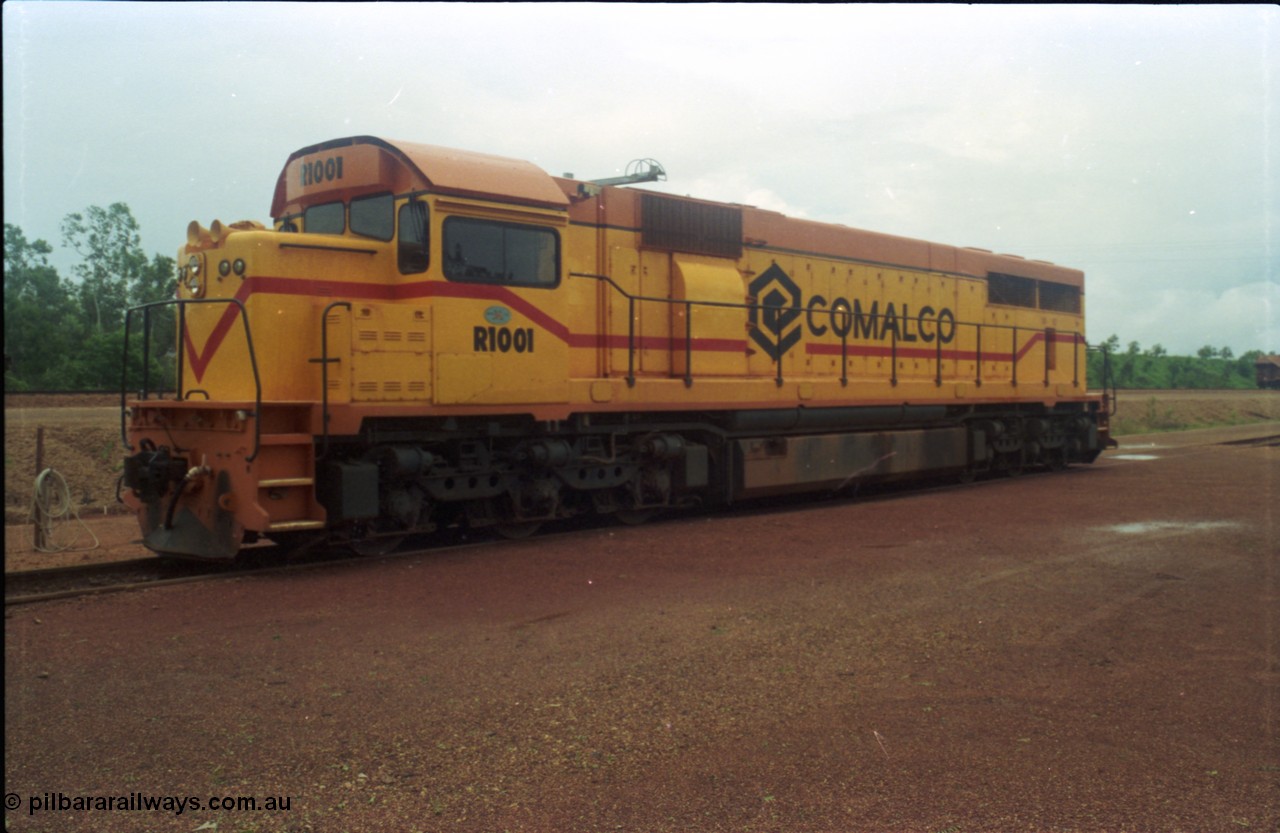 211-27
Weipa, Lorim Point railway workshops, 3/4 RHS or observer's side view of Comalco R 1001 loco Clyde Engineering EMD model GT26C serial 72-752 while is sits at the fuel point, items of note are these units were setup to have the long hood leading, the CCTV camera looking down the long hood, the second 'tropical roof' and the five chime horn cut into the nose. Also noticeable, the units don't have dynamic brakes fitted so there is no brake 'blister' in the middle of the hood like you see on the WAGR L or VR C classes which are also GT26C models.
Keywords: R1001;Clyde-Engineering;EMD;GT26C;72-752;1.001;Comalco;