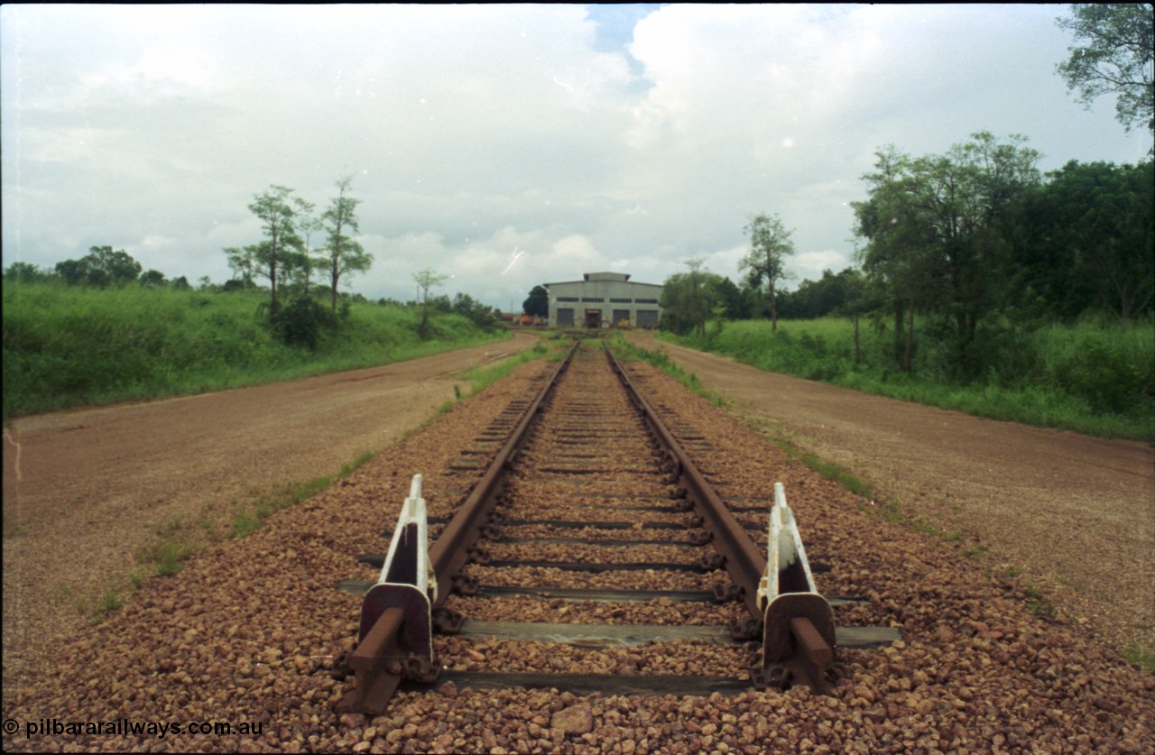 211-28
Weipa, Lorim Point railway workshops, view of the end of the line looking east, workshops in the distance.
