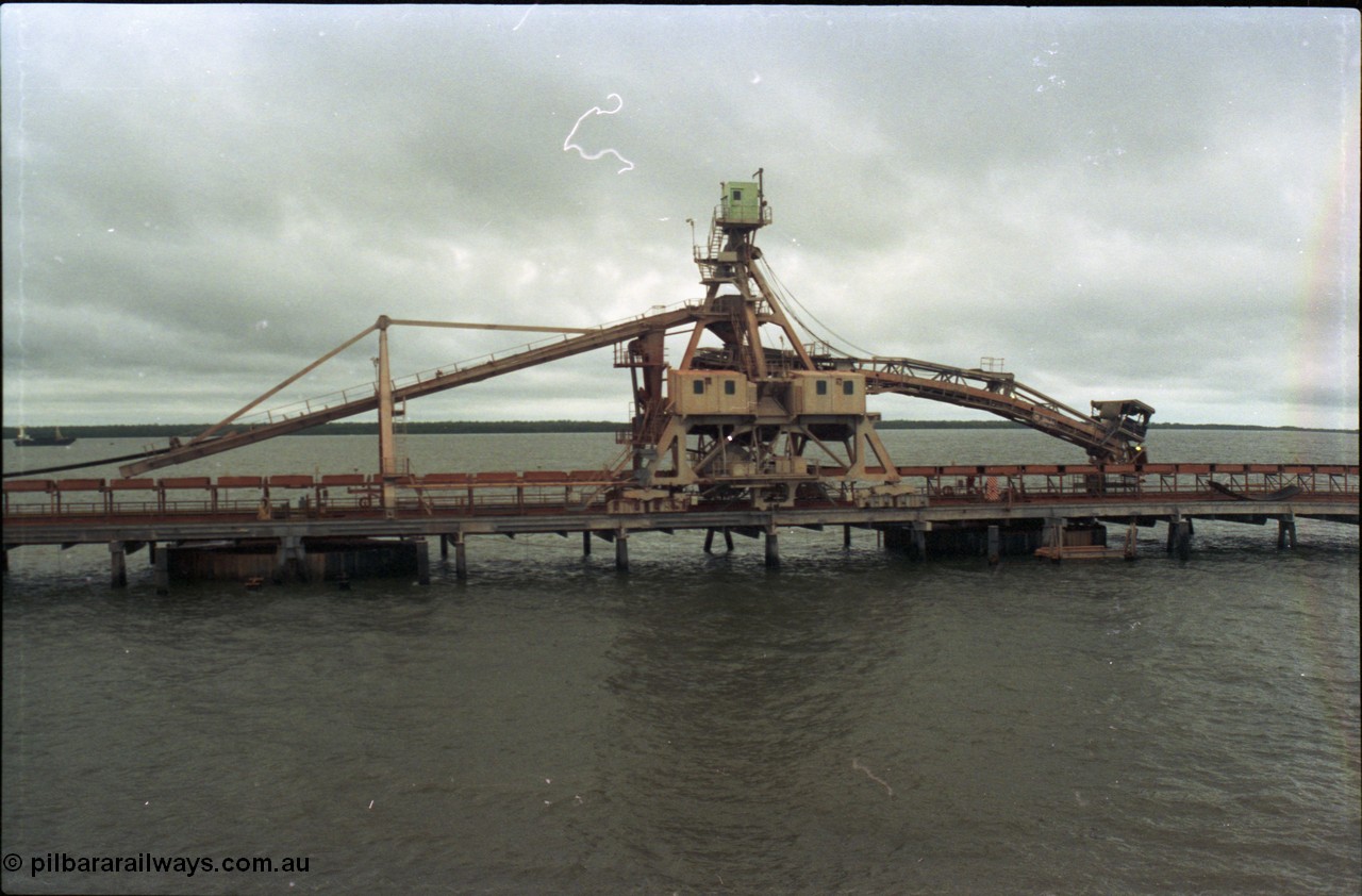 211-29
Weipa, Lorim Point, side view of no. 1 bauxite ship loader in the cyclone tie-down position.
