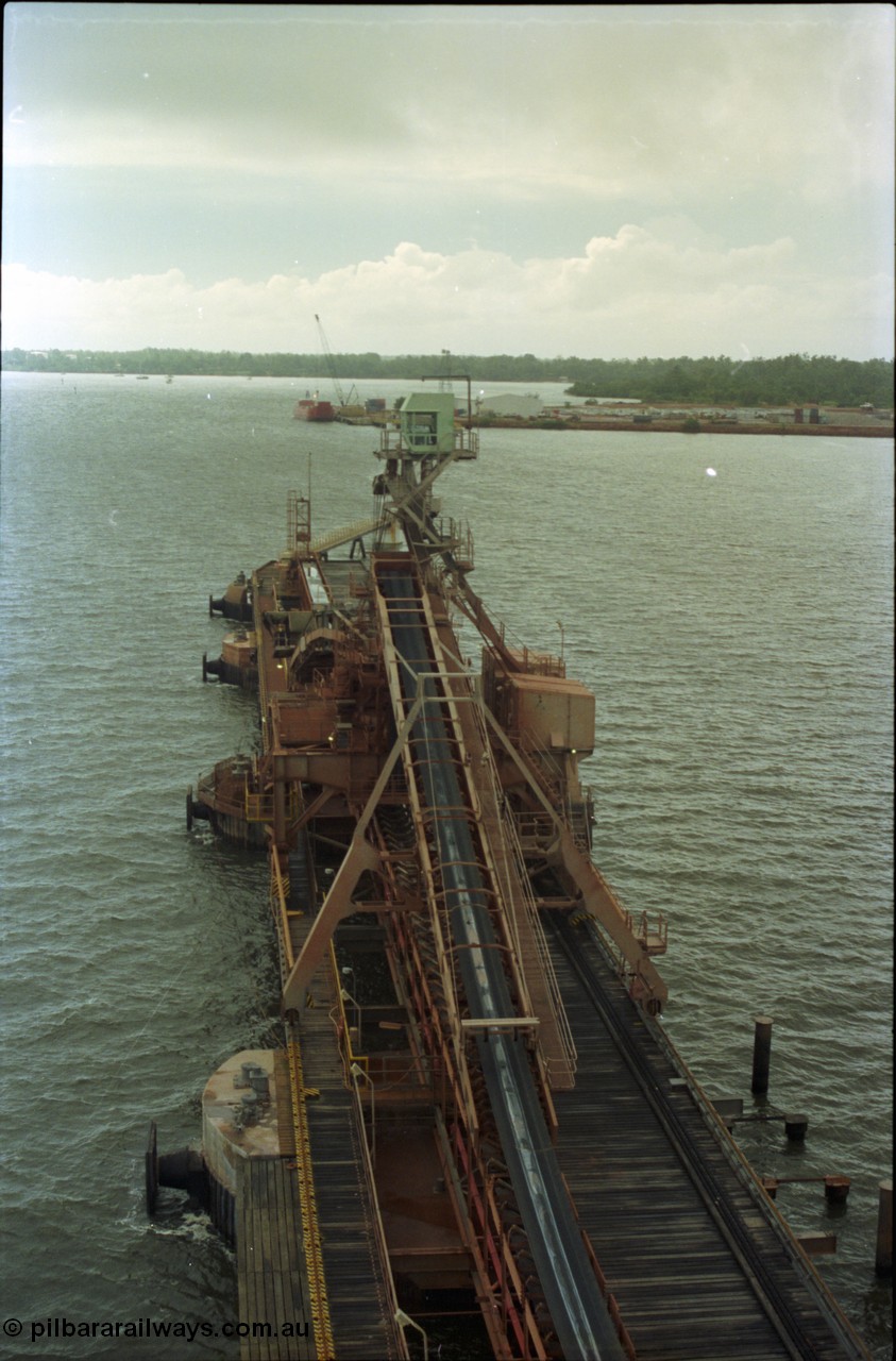 211-33
Weipa, Lorim Point view looking north from kaolin loader across no. 1 ship loader with Humbug Point Wharf (or town wharf) in the distance.
