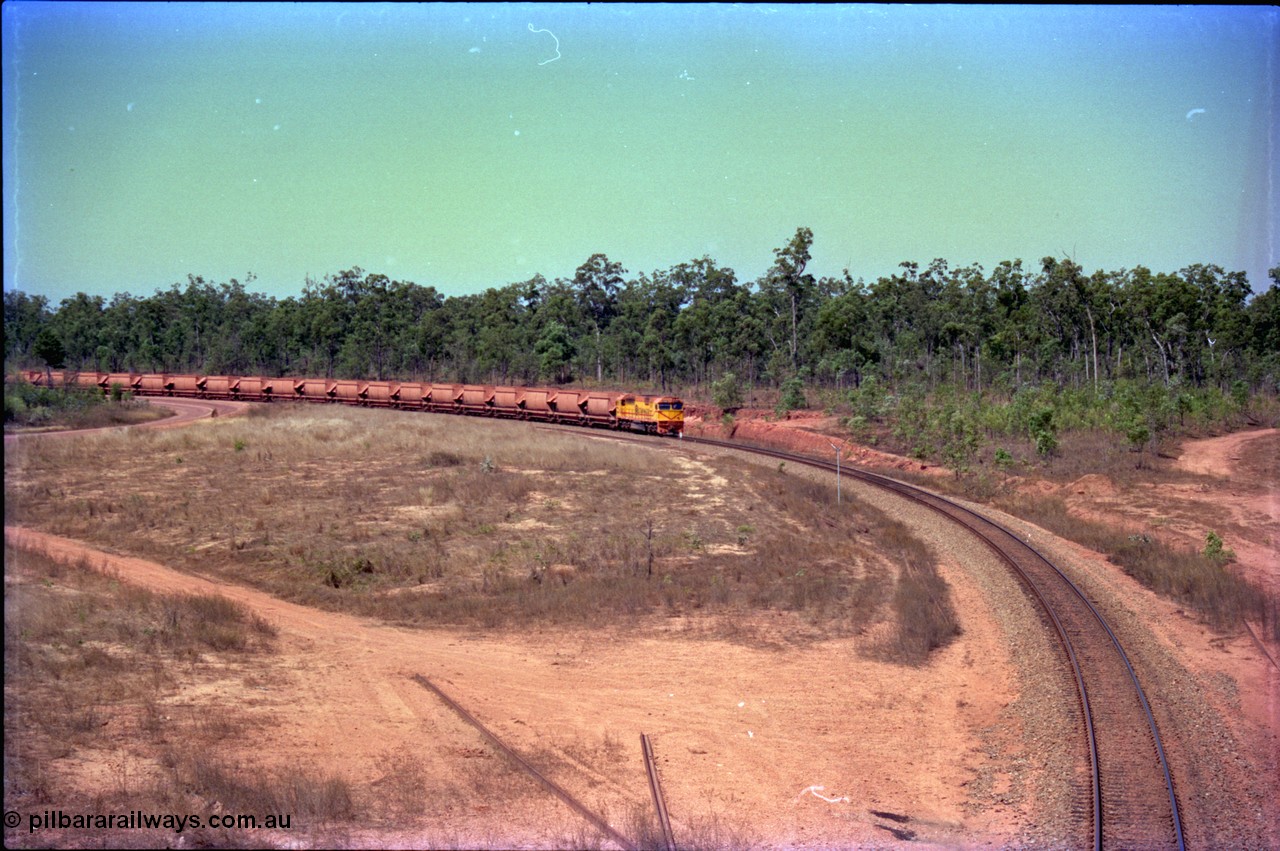 212-09
Weipa, a loaded train from Andoom Mine rounds the curve on approach to Lorim Point behind Comalco R 1004 Clyde Engineering EMD JT26C serial 90-1277 which is former Goldsworthy Mining loco GML 10.
Keywords: R1004;Clyde-Engineering-Kelso-NSW;EMD;JT26C;90-1277;Comalco;GML10;Cinderella;GML-class;