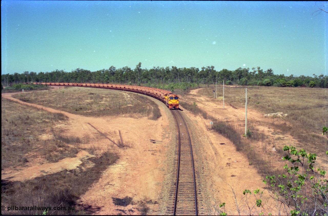 212-12
Weipa, a loaded train from Andoom Mine rounds the curve on approach to Lorim Point behind Comalco R 1004 Clyde Engineering EMD JT26C serial 90-1277 which is former Goldsworthy Mining loco GML 10.
Keywords: R1004;Clyde-Engineering-Kelso-NSW;EMD;JT26C;90-1277;Comalco;GML10;Cinderella;GML-class;