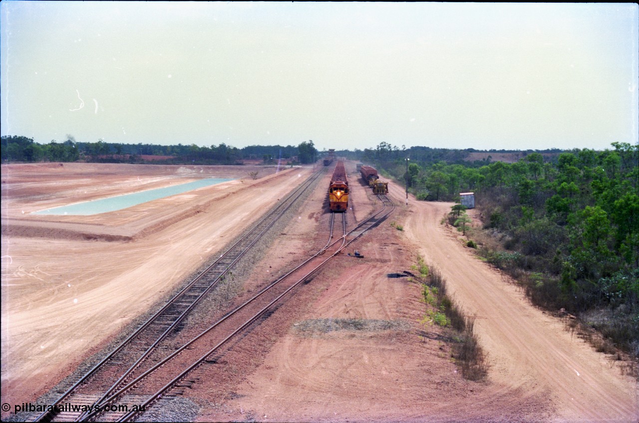 212-24
Weipa, empty train departing Lorim Point for another run to the mine at Andoom behind Comalco R 1001 Clyde Engineering built EMD model GT26C serial 72-752 originally numbered 1.001 and built in 1972. July 1995.
Keywords: R1001;Clyde-Engineering;EMD;GT26C;72-752;1.001;Comalco;