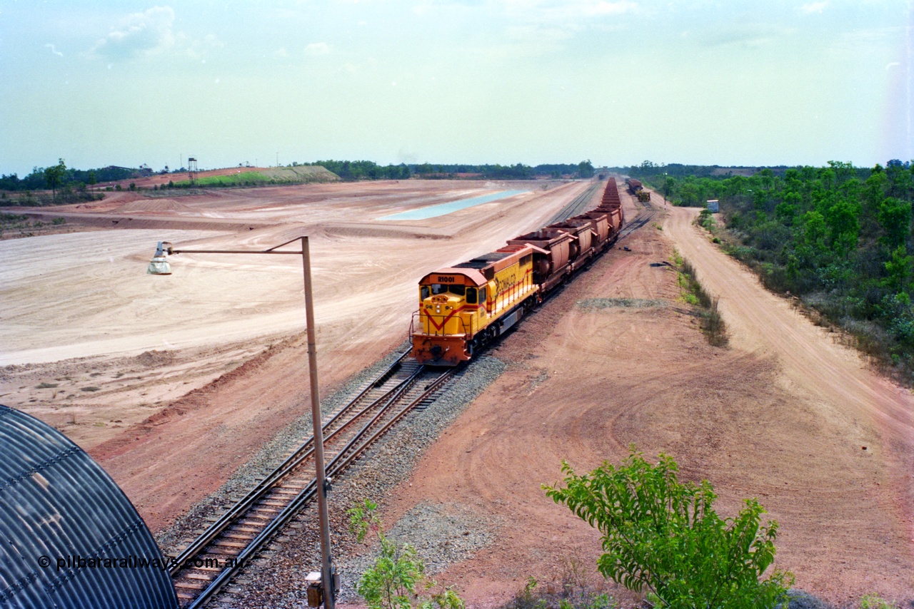 212-25
Comalco Clyde Engineering built EMD model GT26C unit R 1001 serial 72-752 originally numbered 1.001 and built in 1972 leads an empty train as it powers away from Lorim Point bound for Andoom. July 1995.
Keywords: R1001;Clyde-Engineering;EMD;GT26C;72-752;1.001;Comalco;