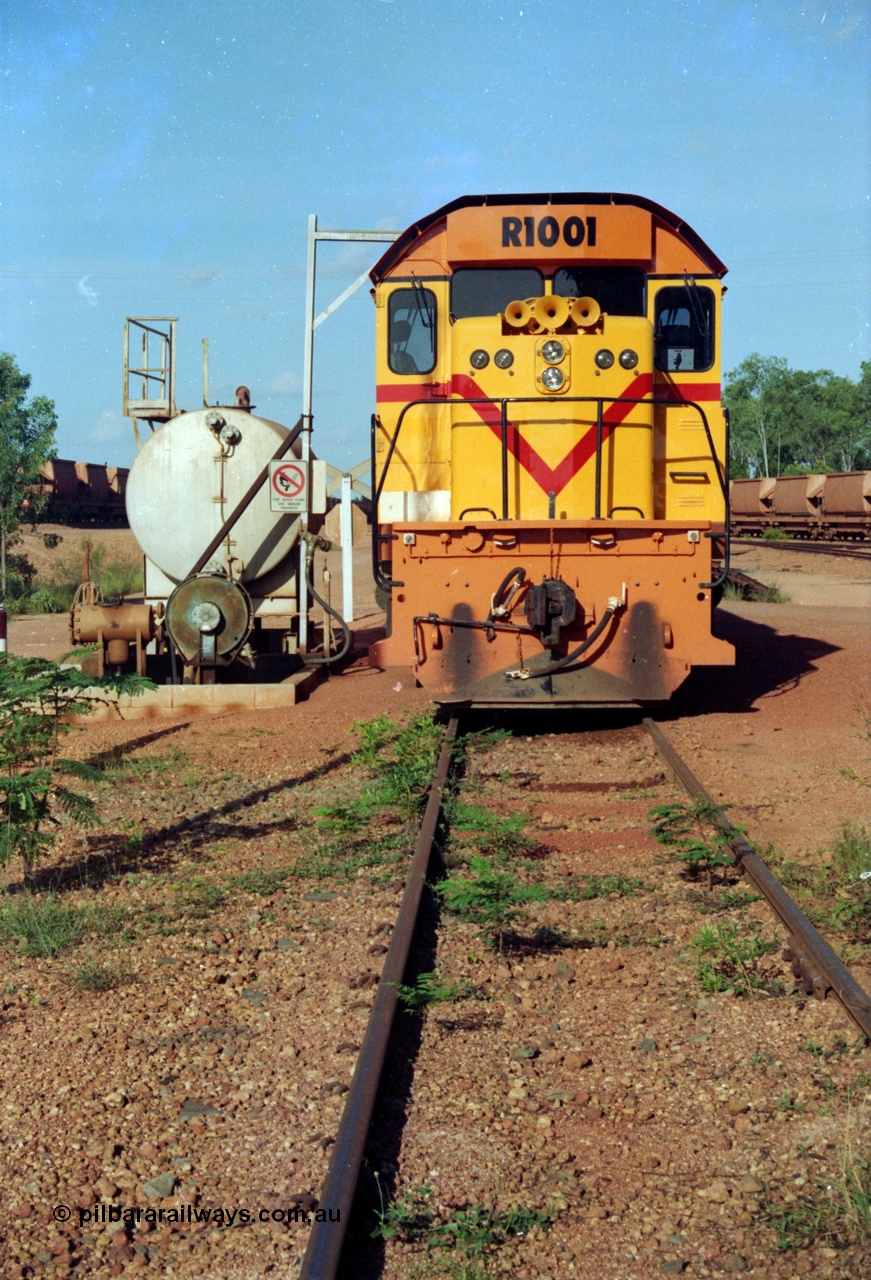 213-02
Weipa, Lorim Point workshops looking east, Comalco R 1001 loco Clyde Engineering built EMD model GT26C serial 72-752 sits at the fuel point, items of note are these units were setup to have the long hood leading, the second 'tropical roof' and the five chime horn cut into the nose. This unit is almost identical to the GT26C models of the WAGR L class. September 1995.
Keywords: R1001;Clyde-Engineering;EMD;GT26C;72-752;1.001;Comalco;