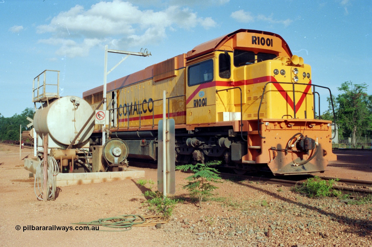 213-04
Weipa, Lorim Point workshops, Comalco R 1001 loco Clyde Engineering built EMD model GT26C serial 72-752 sits at the fuel point, items of note are these units were setup to have the long hood leading, the second 'tropical roof' and the five chime horn cut into the nose. Also noticeable, the units don't have dynamic brakes fitted so there is no brake 'blister' in the middle of the hood like you see on the GT26C models of WAGR L or VR C classes. September 1995.
Keywords: R1001;Clyde-Engineering;EMD;GT26C;72-752;1.001;Comalco;