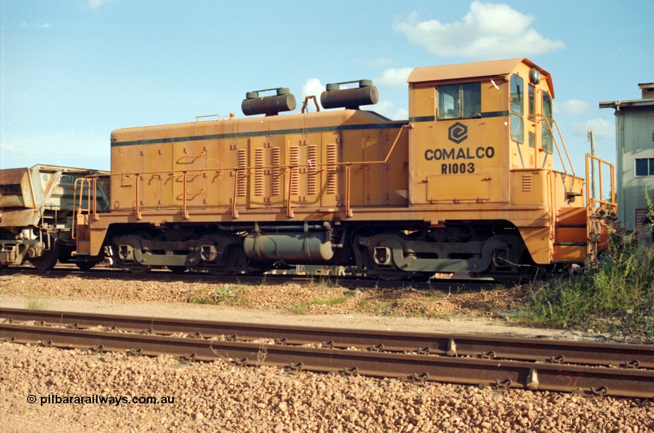 213-06
Weipa, Lorim Point railway workshops. Comalco shunt engine R 1003 coupled to a Difco side dump waggon. R 1003 is an Electro Motive built NW2 model with serial number 4114 and frame number of E761-8 was built in November 1946 at La Grange originally for Canadian National with road number 7943. Sold to Comalco in December 1975 and entered service in 1976. This unit was subsequently scrapped in 2000.
Keywords: R1003;EMD;NW2;4114;E761-8;Comalco;Canadian-National;