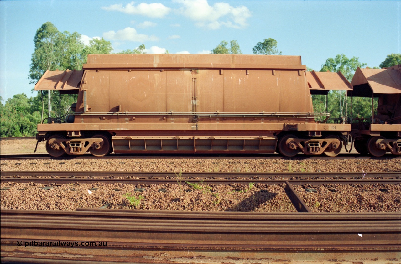 213-10
Weipa, Lorim Point, side view of an HMAS type ore waggon 19, one of the original sixty one waggons built by Comeng Qld in 1971-72 these bottom discharge hoppers are constructed from aluminium.
Keywords: HMAS-type;Comeng-Qld;Comalco;