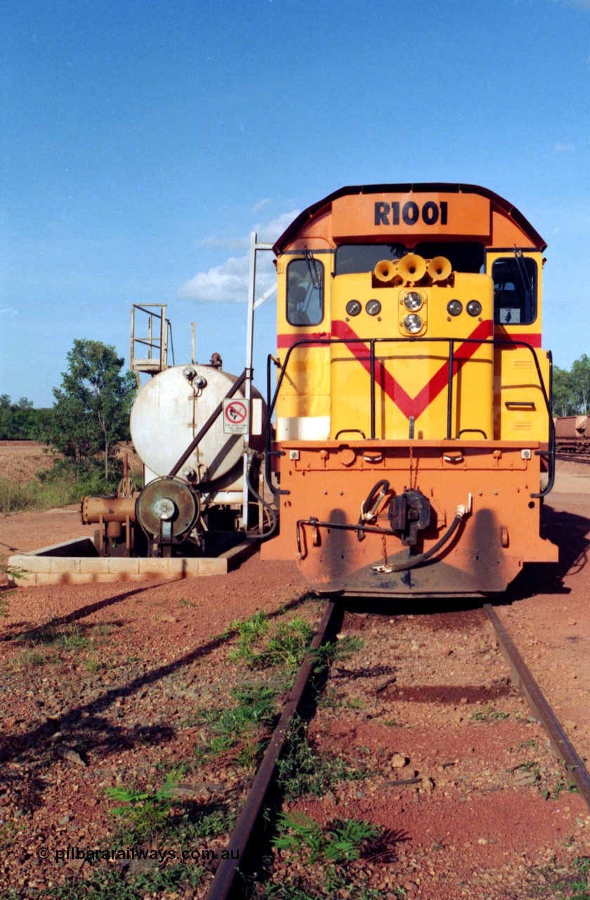 213-12
Weipa, Lorim Point workshops, Comalco R 1001 loco Clyde Engineering built EMD model GT26C serial 72-752 sits at the fuel point, items of note are these units were setup to have the long hood leading, the second 'tropical roof' and the five chime horn cut into the nose. This unit is almost identical to the GT26C models of the WAGR L class. September 1995.
Keywords: R1001;Clyde-Engineering;EMD;GT26C;72-752;1.001;Comalco;