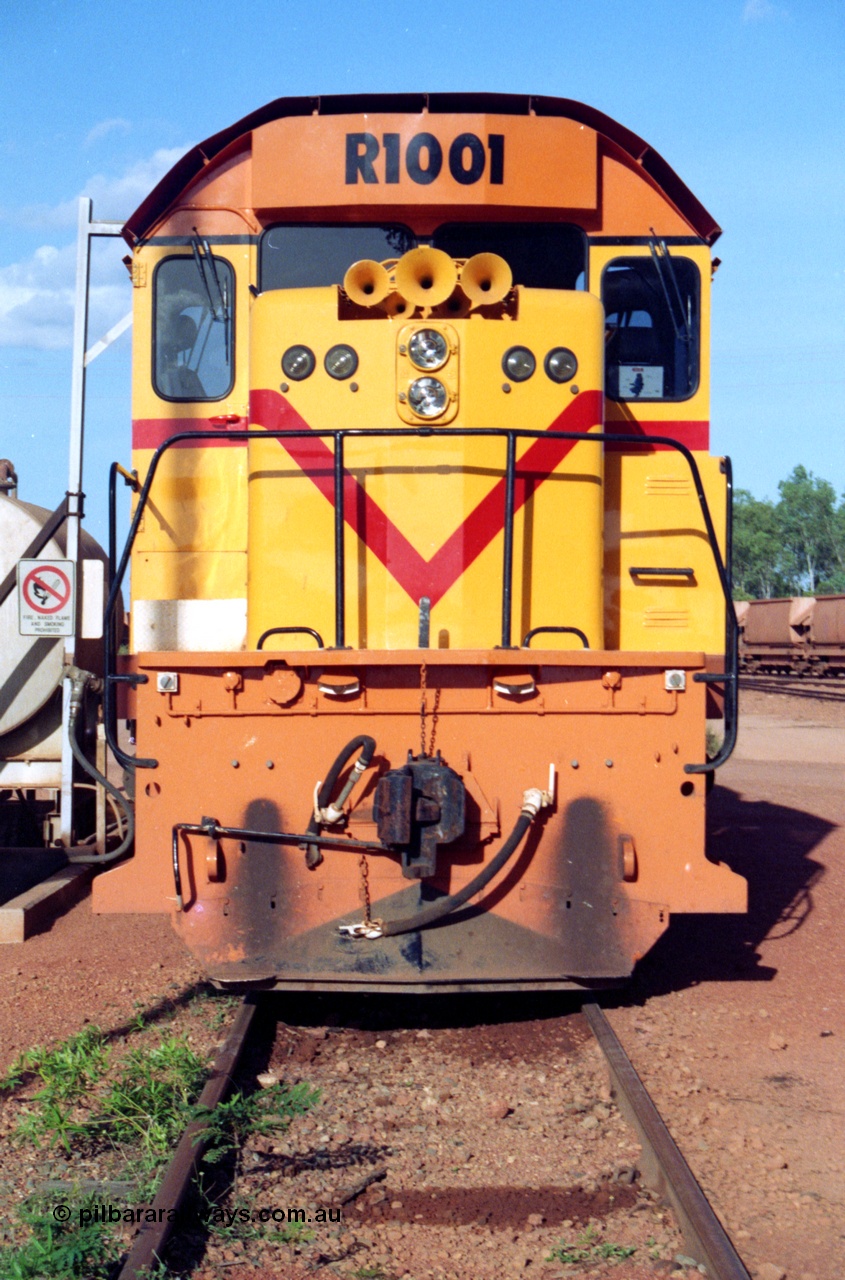 213-13
Weipa, Lorim Point workshops looking east, Comalco R 1001 loco Clyde Engineering built EMD model GT26C serial 72-752 sits at the fuel point, items of note are these units were setup to have the long hood leading, the second 'tropical roof' and the five chime horn cut into the nose. This unit is almost identical to the GT26C models of the WAGR L class. September 1995.
Keywords: R1001;Clyde-Engineering;EMD;GT26C;72-752;1.001;Comalco;