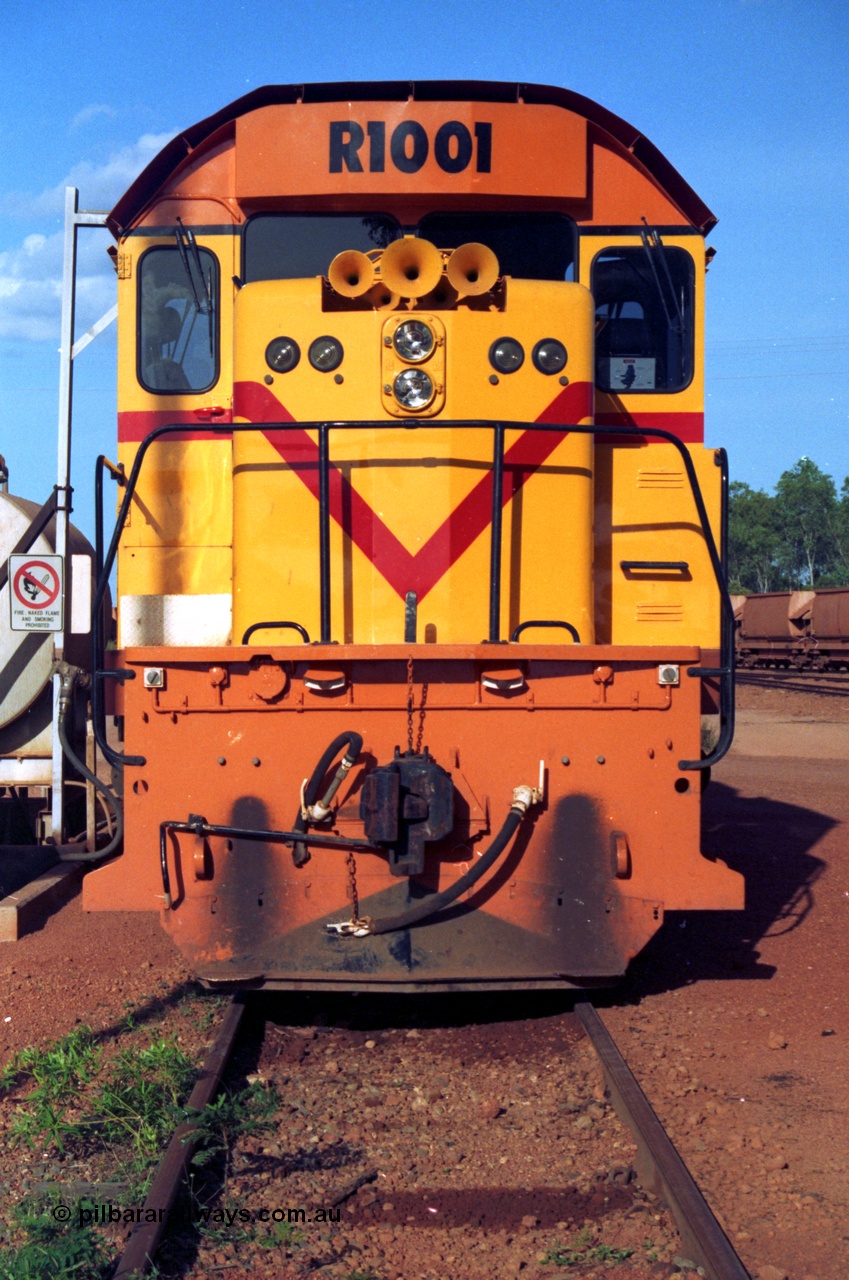 213-14
Weipa, Lorim Point workshops looking east, Comalco R 1001 loco Clyde Engineering built EMD model GT26C serial 72-752 sits at the fuel point, items of note are these units were setup to have the long hood leading, the second 'tropical roof' and the five chime horn cut into the nose. This unit is almost identical to the GT26C models of the WAGR L class. September 1995.
Keywords: R1001;Clyde-Engineering;EMD;GT26C;72-752;1.001;Comalco;