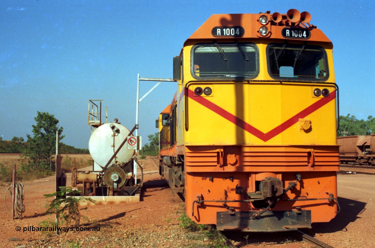 213-22
Weipa, Lorim Point fuel point, Comalco R 1004 loco Clyde Engineering built EMD model JT42C built 1990 serial 90-1277, weight 132 tonne, engine 12-710G3A, generator AR11-WBA-CA5, traction motors D87ETR, rated power 2460 kW/3300 hp. The body is similar to a V/Line N class while the components are the same as the Australian National AN class. Originally built for Goldsworthy Mining as GML 10 for use at their Western Australian iron ore railway and locally known as Cinderella. Purchased by Comalco in 1994 following the takeover of Goldsworthy by BHP.
Keywords: R1004;Clyde-Engineering-Kelso-NSW;EMD;JT26C;90-1277;Comalco;GML10;Cinderella;GML-class;