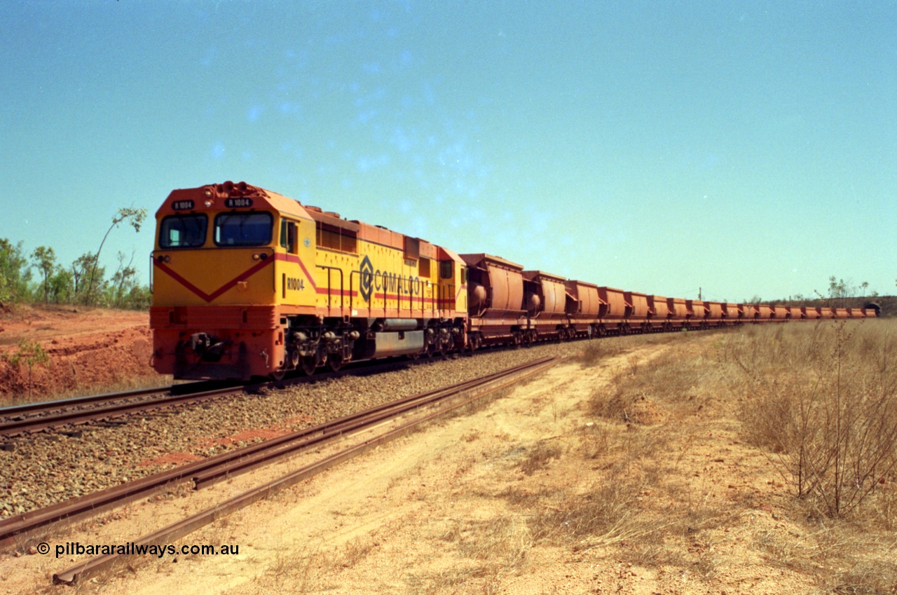 213-36
Weipa, an empty train departs Lorim Point behind Comalco R 1004 a Clyde Engineering built EMD model JT42C built 1990 serial 90-1277 originally as GML 10 for Goldsworthy Mining in Western Australia, bought by Comalco in 1994.
Keywords: R1004;Clyde-Engineering-Kelso-NSW;EMD;JT26C;90-1277;Comalco;GML10;Cinderella;GML-class;