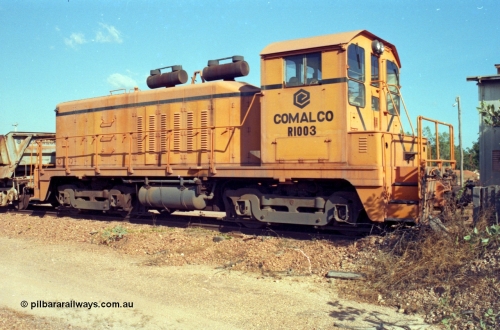 213-26
Weipa, Lorim Point railway workshops. Comalco shunt engine R 1003 coupled to a Difco side dump waggon. R 1003 is an Electro Motive built NW2 model with serial number 4114 and frame number of E761-8 was built in November 1946 at La Grange originally for Canadian National with road number 7943. Sold to Comalco in December 1975 and entered service in 1976. This unit was subsequently scrapped in 2000.
Keywords: R1003;EMD;NW2;4114;E761-8;Comalco;Canadian-National;