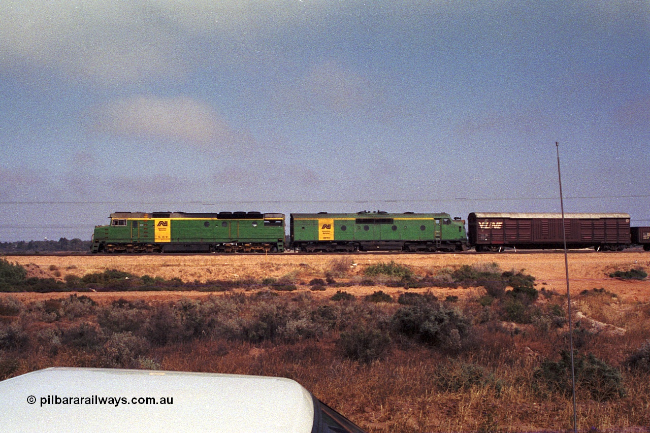 215-04
Port Augusta, side view of AN livered DL class DL 46 Clyde Engineering EMD model AT42C serial 88-1254 and GM class GM 18 Clyde Engineering EMD model A16C serial 57-139.
Keywords: DL-class;DL46;Clyde-Engineering-Kelso-NSW;EMD;AT42C;88-1254;
