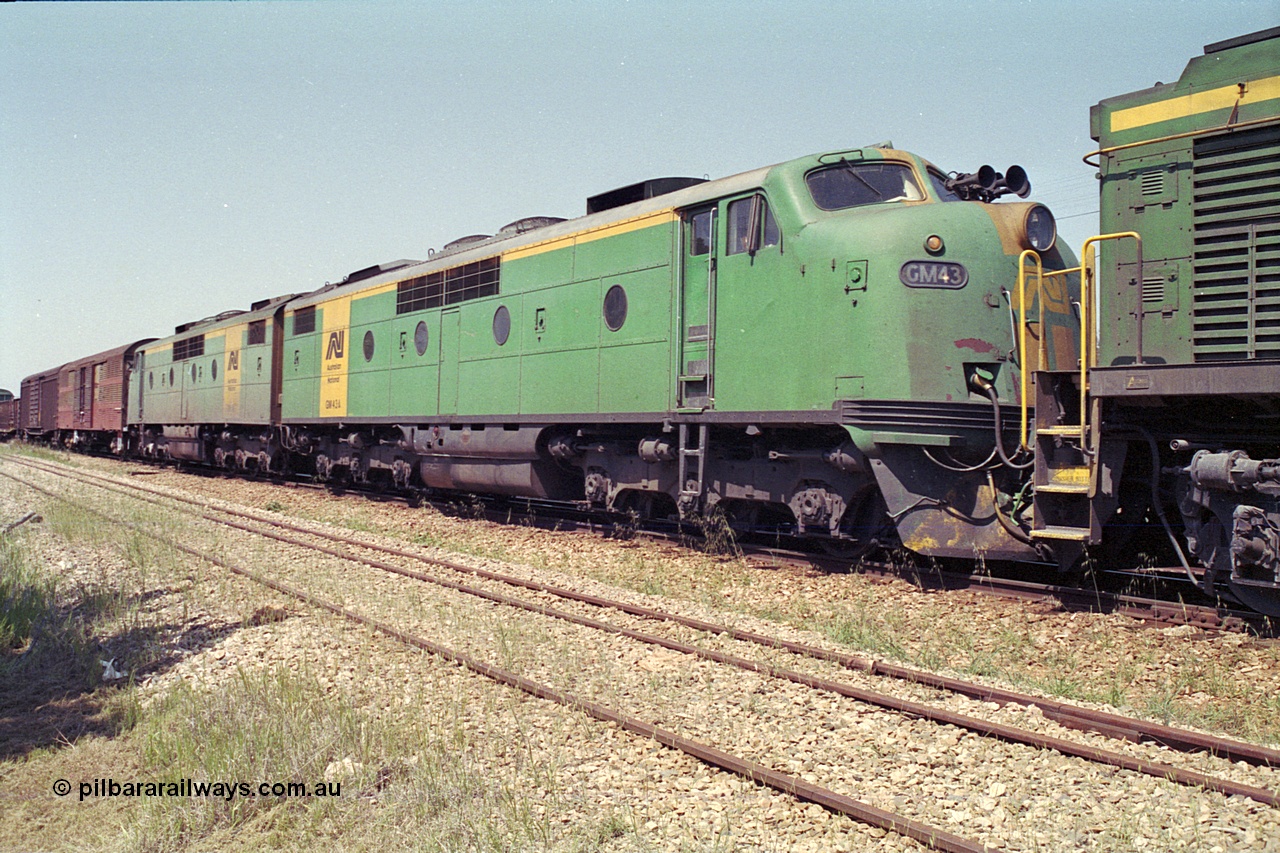 215-09
Peterborough, double Bulldog GM class units GM 43 Clyde Engineering EMD model A16C serial 67-529 and GM 46 serial 67-532 in the consist of power for an SP service awaiting line clear.
Keywords: GM-class;GM43;Clyde-Engineering-Granville-NSW;EMD;A16C;67-529;