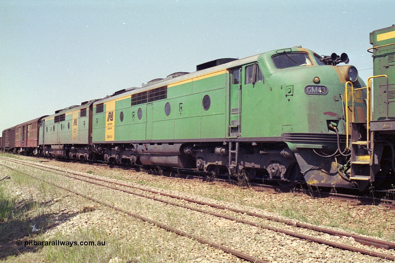 215-10
Peterborough, double Bulldog GM class units GM 43 Clyde Engineering EMD model A16C serial 67-529 and GM 46 serial 67-532 in the consist of power for an SP service awaiting line clear.
Keywords: GM-class;GM43;Clyde-Engineering-Granville-NSW;EMD;A16C;67-529;