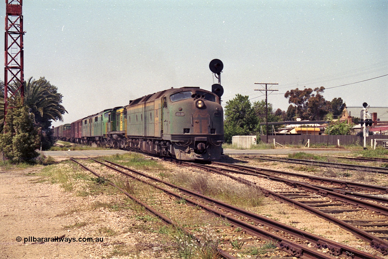 215-11
Peterborough, an SP Perth bound service crosses Sliver Street behind the AN liveried quad combination of Clyde Engineering EMD model AT26C CL class Bulldog CL 11 serial 71-739 which in later life became CLF 2, ALCo model DL541 600 class 605 serial G6015/04 which went on to become , and EMD model A16C GM class Bulldog units GM 43 serial 67-529 and GM 46 serial 67-532.
Keywords: CL-class;600-class;GM-class;CL11;605;GM43;GM46;bulldog;AT26C;DL541;71-739;G6015-4;AE-Goodwin;ALCo;EMD;Clyde-Engineering-Granville-NSW;A16C;67-529;67-532;