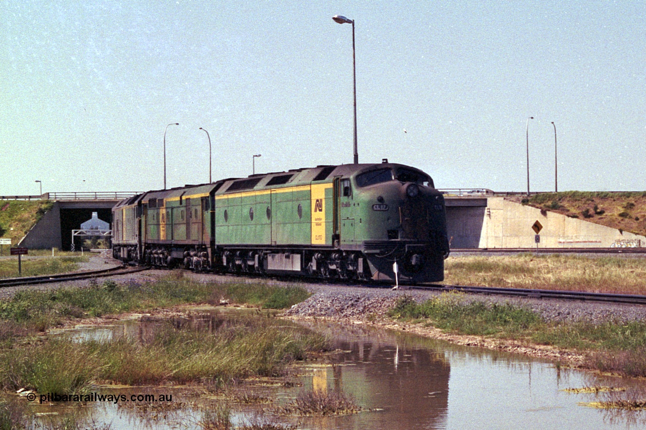 215-18
Dry Creek Motive Power Centre, Australian National trio of standard gauge light engines wearing the AN livery with the final Clyde Engineering EMD model AT26C Bulldog ever built CL class CL 17 'William McMahon' serial 71-757 leading an ALCo 700 class and a Clyde Engineering EMD BL class.
Keywords: CL-class;CL17;Clyde-Engineering-Granville-NSW;EMD;AT26C;71-757;bulldog;