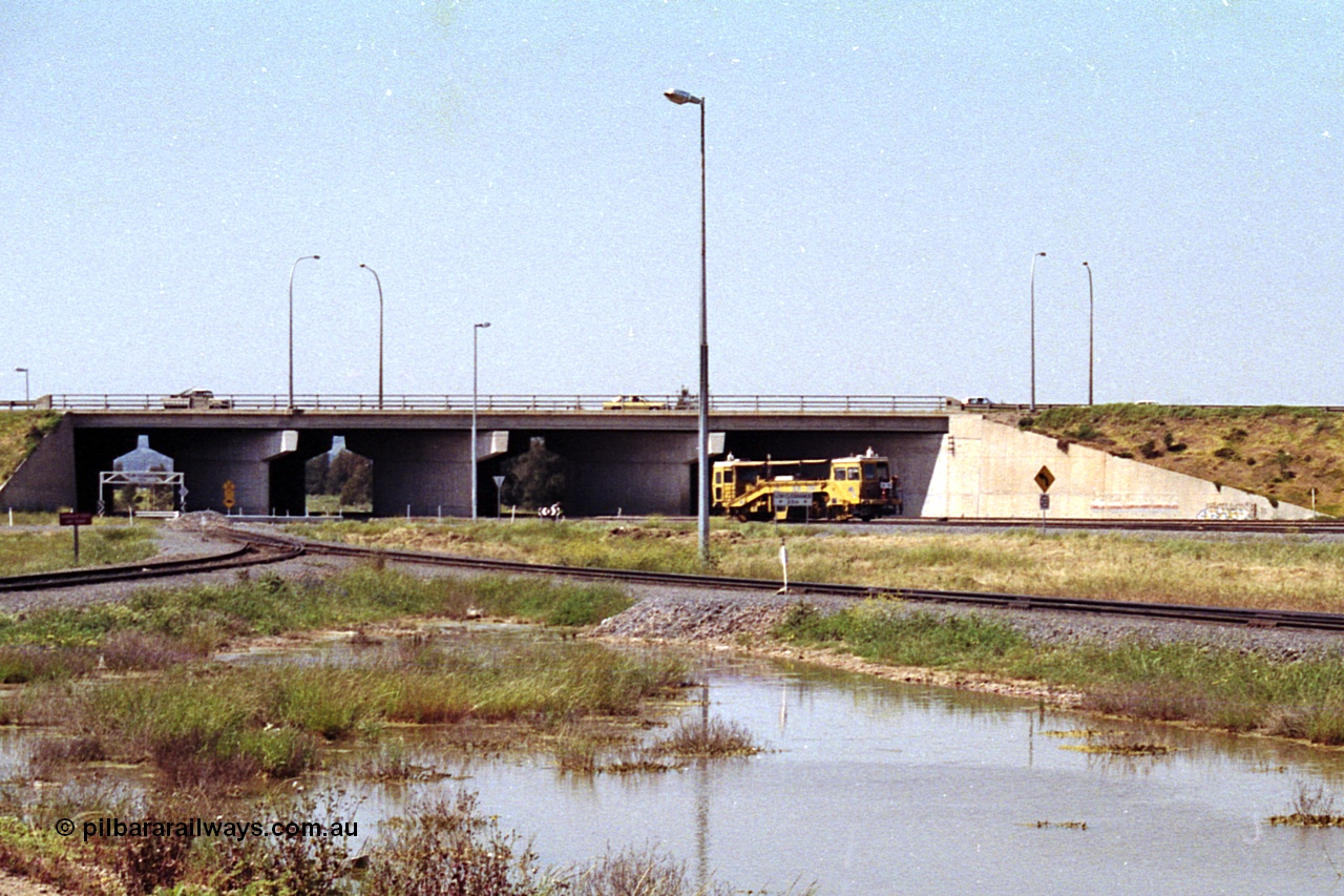 215-24
Dry Creek Motive Power Centre, view looking north as a track tamper arrives into Dry Creek Yard.
