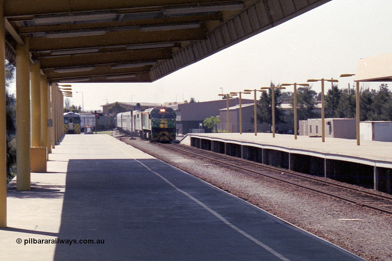 215-28
Keswick, the Australian National Adelaide interstate passenger terminal with the Indian Pacific arriving behind EL class EL 62 Goninan built General Electric CM30-8 serial 8013-07/90-114 with a GM class as second unit.
Keywords: EL-class;EL62;Goninan;GE;CM30-8;8013-07/90-114;