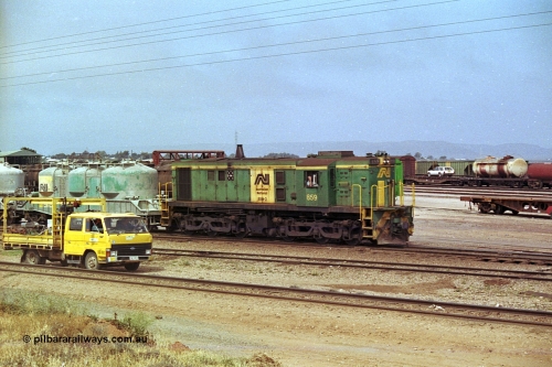 215-06
Port Augusta, AN liveried 830 class locomotive 859 AE Goodwin ALCo model DL531 serial 84705 performs shunting duties in the yard.
Keywords: 830-class;859;AE-Goodwin;ALCo;DL531;84705;