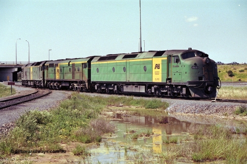 215-16
Dry Creek Motive Power Centre, Australian National trio of standard gauge light engines wearing the AN livery with the final Clyde Engineering EMD model AT26C Bulldog ever built CL class CL 17 'William McMahon' serial 71-757 leading an ALCo 700 class and a Clyde Engineering EMD BL class.
Keywords: CL-class;CL17;Clyde-Engineering-Granville-NSW;EMD;AT26C;71-757;bulldog;