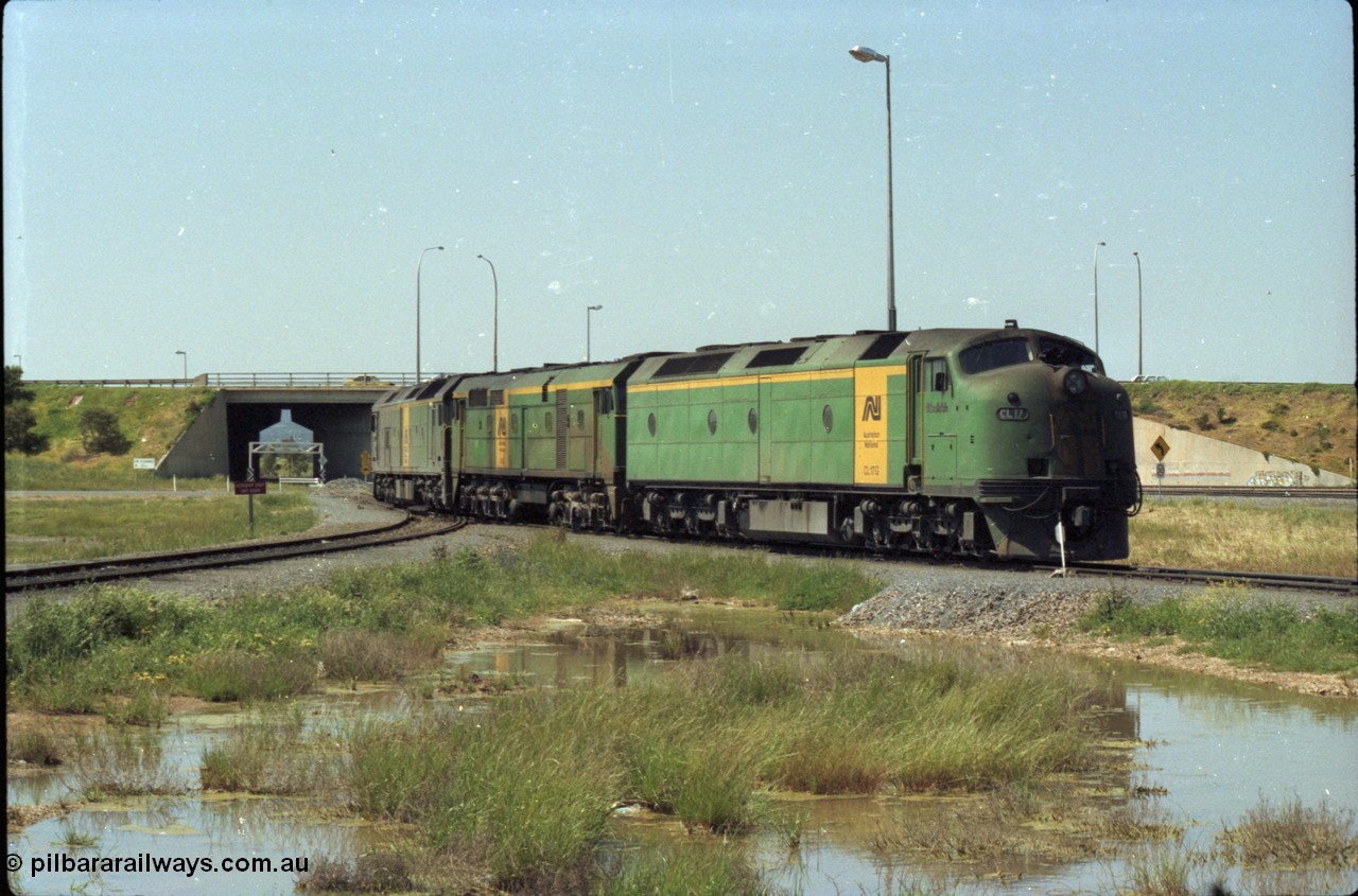 216-09
Dry Creek Motive Power Centre, Australian National trio of standard gauge light engines wearing the AN livery with CL class CL 17 'William McMahon' Clyde Engineering EMD model AT26C serial 71-757 leading a 700 class and a BL class.
Keywords: CL-class;CL17;Clyde-Engineering-Granville-NSW;EMD;AT26C;71-757;bulldog;