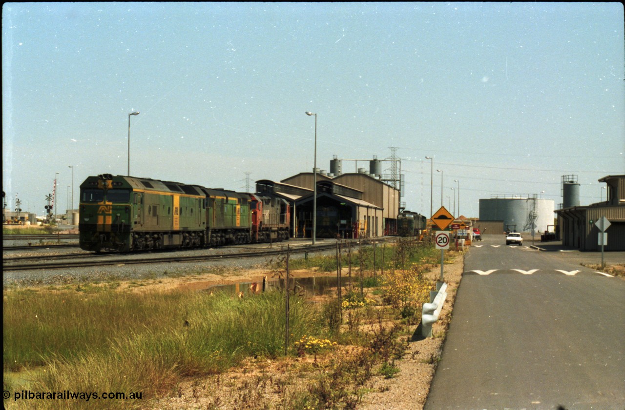 216-12
Dry Creek Motive Power Centre, fuel point roads, AN BL class BL 31 Clyde Engineering EMD model JT26C-2SS serial 83-1015 with 700 class 704 AE Goodwin ALCo model DL500G serial G6059-2 rest between jobs with V/Line broad gauge N class behind them and a 930 class beside the shed.
Keywords: BL-class;BL31;Clyde-Engineering-Rosewater-SA;EMD;JT26C-2SS;83-1015;