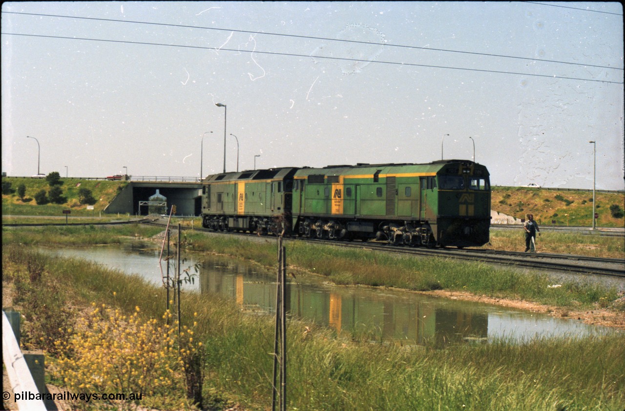 216-13
Dry Creek Motive Power Centre, Australian National standard gauge light engines wearing the AN livery 700 class 705 AE Goodwin ALCo model DL500G serial G6059-3 and BL class leader BL 26 'Bob Hawke' Clyde Engineering EMD model JT26C-2SS serial 83-1010.
Keywords: 700-class;705;AE-Goodwin;ALCo;DL500G;G6059-3;