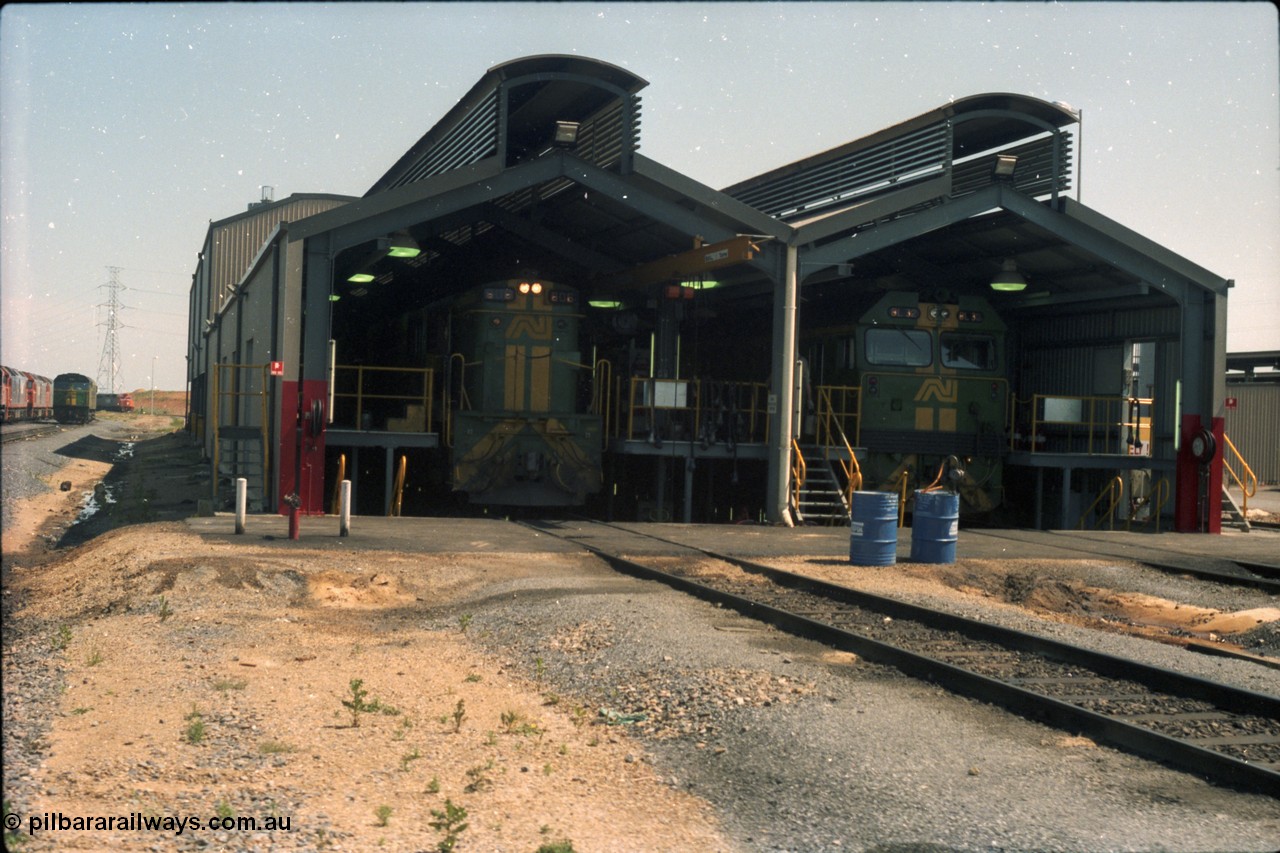 216-18
Dry Creek Motive Power Centre, fuel point shed, standard gauge road on the left with 600 class 606 AE Goodwin ALCo model DL541 serial G6015-5 and dual gauge road on the left with BL class BL 32 Clyde Engineering EMD model JT26C-2SS serial 83-1016.
Keywords: 600-class;606;AE-Goodwin;ALCo;DL541;G6015-5;