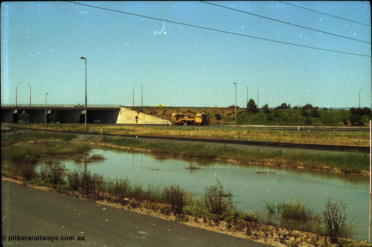 216-20
Dry Creek Motive Power Centre, view looking north as a track tamper arrives into Dry Creek Yard.
