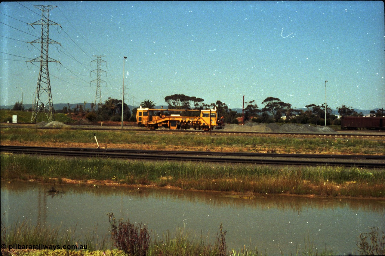 216-21
Dry Creek Motive Power Centre, view looking north as a track tamper arrives into Dry Creek Yard.
