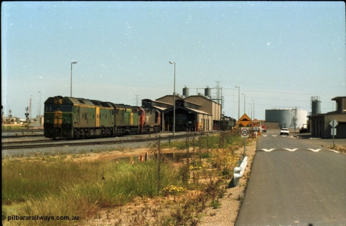 216-12
Dry Creek Motive Power Centre, fuel point roads, AN BL class BL 31 Clyde Engineering EMD model JT26C-2SS serial 83-1015 with 700 class 704 AE Goodwin ALCo model DL500G serial G6059-2 rest between jobs with V/Line broad gauge N class behind them and a 930 class beside the shed.
Keywords: BL-class;BL31;Clyde-Engineering-Rosewater-SA;EMD;JT26C-2SS;83-1015;