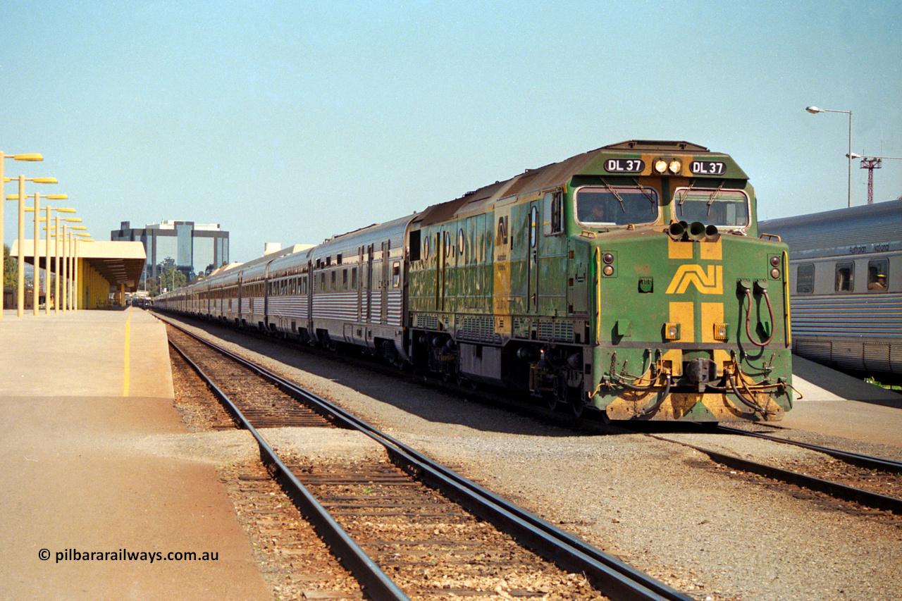 217-05
Keswick Passenger Terminal, Australian National DL class locomotive DL 37 Clyde Engineering EMD model AT42C serial 88-1245 on the pointy end of 'The Ghan' as departure time approaches.
Keywords: DL-class;DL37;Clyde-Engineering-Kelso-NSW;EMD;AT42C;88-1245;