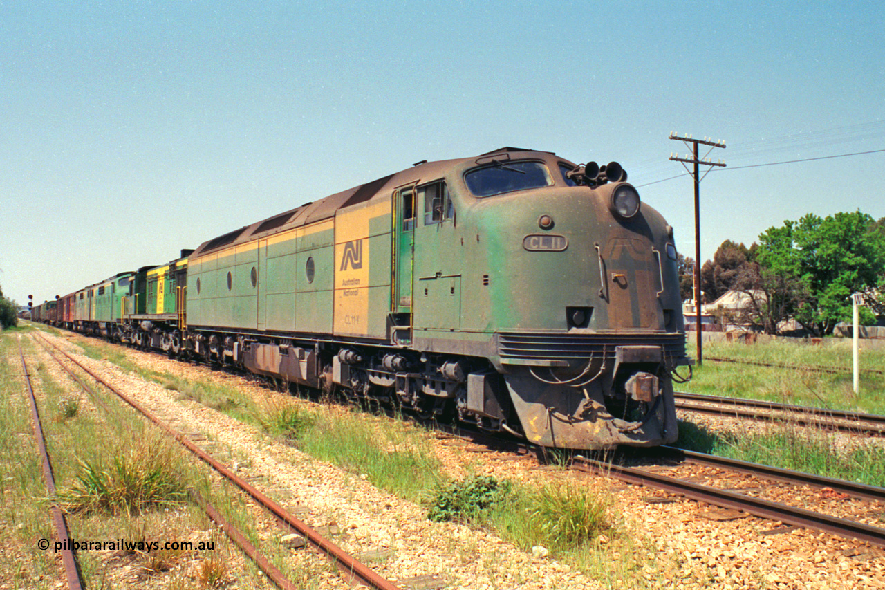 217-10
Peterborough, an SP Perth bound service awaiting line clear behind the AN liveried quad combination of CL class Bulldog CL 11 Clyde Engineering EMD model AT26C serial 71-739, 600 class 605 AE Goodwin ALCo model DL541 serial G6015-4, and GM class Bulldogs GM 43 Clyde Engineering EMD model A16C serial 67-529 and GM 46 serial 67-532.
Keywords: CL-class;CL11;Clyde-Engineering-Granville-NSW;EMD;AT26C;bulldog;