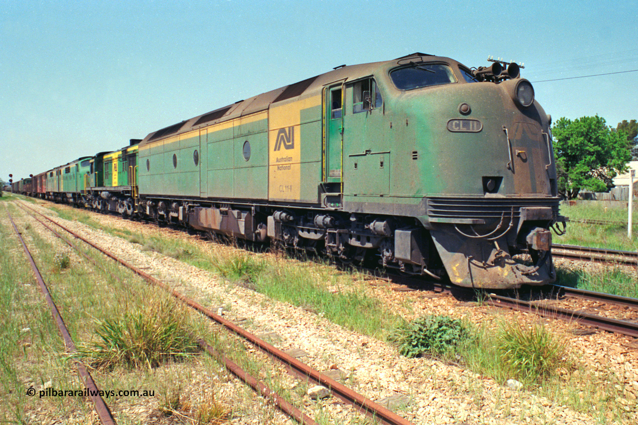 217-11
Peterborough, an SP Perth bound service awaiting line clear behind the AN liveried quad combination of CL class Bulldog CL 11 Clyde Engineering EMD model AT26C serial 71-739, 600 class 605 AE Goodwin ALCo model DL541 serial G6015-4, and GM class Bulldogs GM 43 Clyde Engineering EMD model A16C serial 67-529 and GM 46 serial 67-532.
Keywords: CL-class;CL11;Clyde-Engineering-Granville-NSW;EMD;AT26C;bulldog;