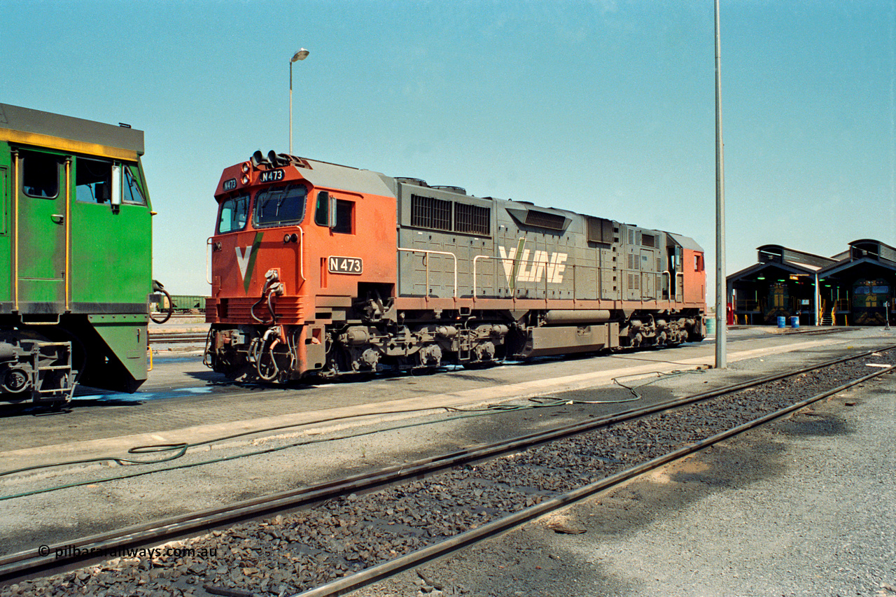 217-25
Dry Creek Motive Power Centre, fuel point roads sees V/Line broad gauge N class locomotive N 473 Clyde Engineering EMD model JT22HC-2 serial 87-1202 resting after running the overnight passenger train 'The Overland' from Melbourne and will return with the Melbourne bound service in the early evening.
Keywords: N-class;N473;Clyde-Engineering-Somerton-Victoria;EMD;JT22HC-2;87-1202;