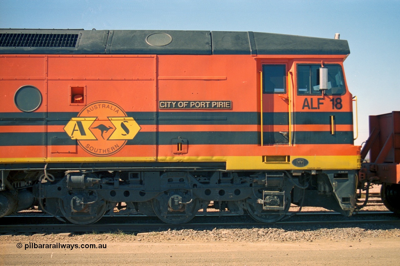 244-10
Port Augusta yard, cab side shot of Morrison Knudsen rebuild unit ALF 18 City of Port Pirie, model JT26C-2M serial 94-AN-018 in Australian Southern livery, originally AL class AL 21.
Keywords: ALF-class;ALF18;MKA;EMD;JT26C-2M;94-AN-018;rebuild;AL-class;AL21;Clyde-Engineering;EMD;JT26C;76-837;